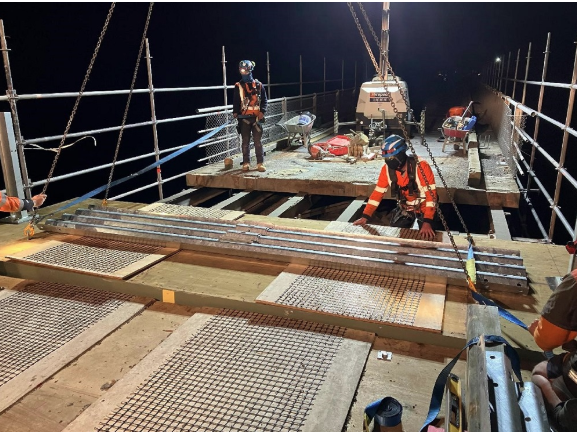 Workers securing bridge through the night